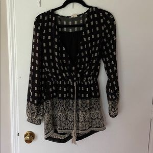 Black patterned romper.